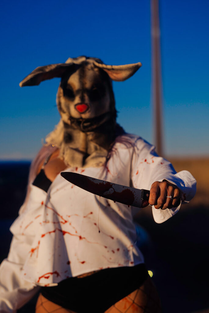 Horror photo shoot with a rabbit mask and Bloody Knife